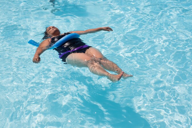 A woman cools off at the Glassell Park Pool on June 28th, 2013.