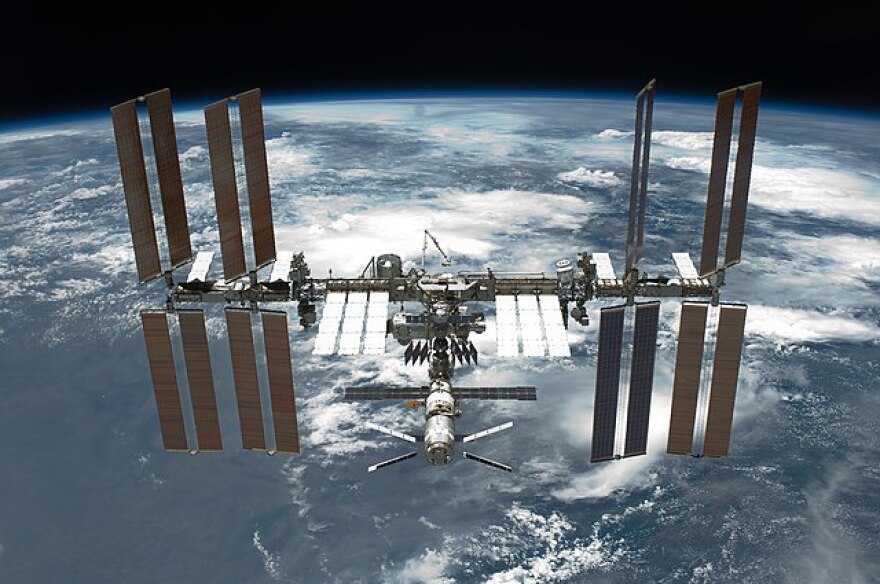 Image of the International Space Station orbiting Earth. 