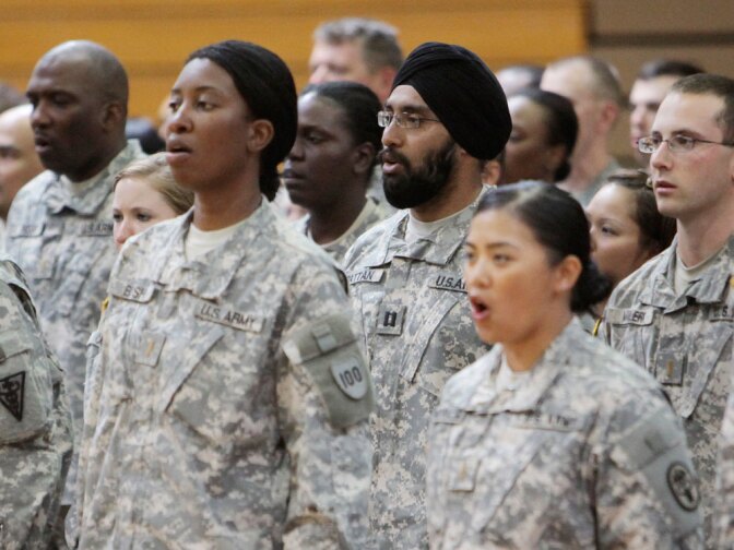 U.S. Army Capt. Tejdeep Singh Rattan, wearing a turban, stands with other graduates as they sing "The Army Goes Rolling Along" during a U.S. Army officer basic training graduation ceremony at Fort Sam Houston in San Antonio on Monday.