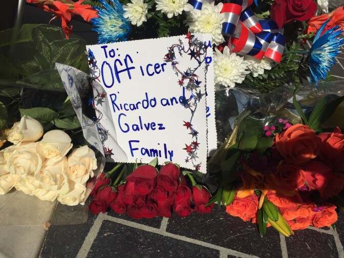 A makeshift memorial outside the Downey Police station, where Officer Ricardo Galvez was shot to death late Wednesday.