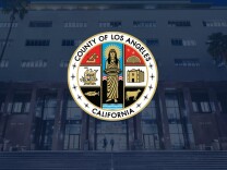 The logo of Los Angeles County sits atop and image of the main administration building faded in the background.