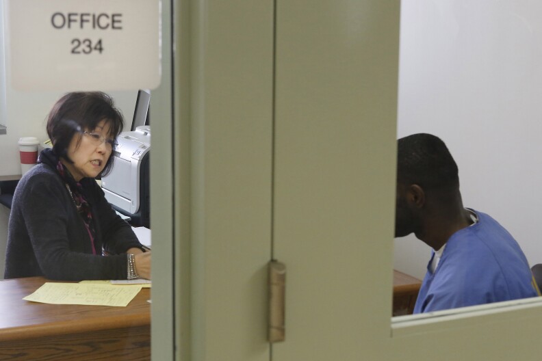 Psychologist, Dr. Naiwon Chung, performs an evaluation of an inmate at the new mental health treatment unit the California Medical Facility in Vacaville, Calif., Thursday, Feb. 14, 2013.  The  $24 million treatment center for mentally ill inmates opened on Thursday as state corrections officials used the occasion to push for ending federal oversight of that aspect of prison operations. The 44,000-square-foot building includes rooms where inmates will undergo individual, group and recreational outpatient therapy. It will be used to treat inmates who are seriously mentally ill but are able to function without around-the-clock care.