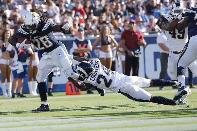 LOS ANGELES, CA - AUGUST 26:  Melvin Gordon #28 of the Los Angeles Chagers breaks free from Blake Countess #24 of the Los Angeles Rams in the first quarter of the preseason game between the Los Angeles Rams and Los Angeles Chargers at the Los Angeles Memorial Coliseum on August 26, 2017 in Los Angeles, California.  (Photo by Josh Lefkowitz/Getty Images)