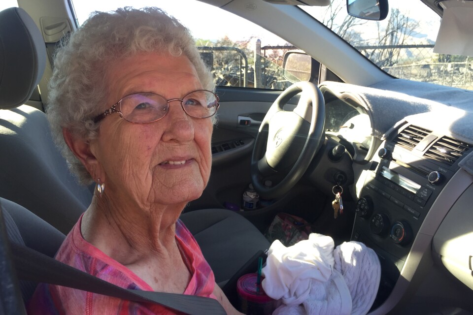 Charlene Vehlewald sits in a car outside of her daughter's home that burned to the ground in the South Lake community northeast of Bakersfield. It was one of more than 250 homes destroyed by the Erskine Fire. 
