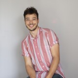 Portait of Evan Jacoby on a gray background