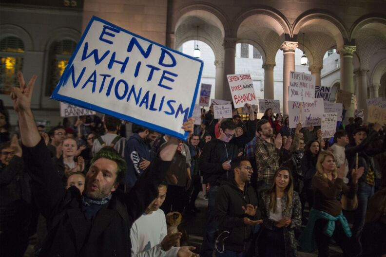 People protest the appointment of white nationalist alt-right media mogul, former Breitbart News head Steve Bannon, to be chief strategist of the White House by President-elect Donald Trump on November 16, near City Hall in Los Angeles, California. / AFP / DAVID MCNEW        (Photo credit should read DAVID MCNEW/AFP/Getty Images)