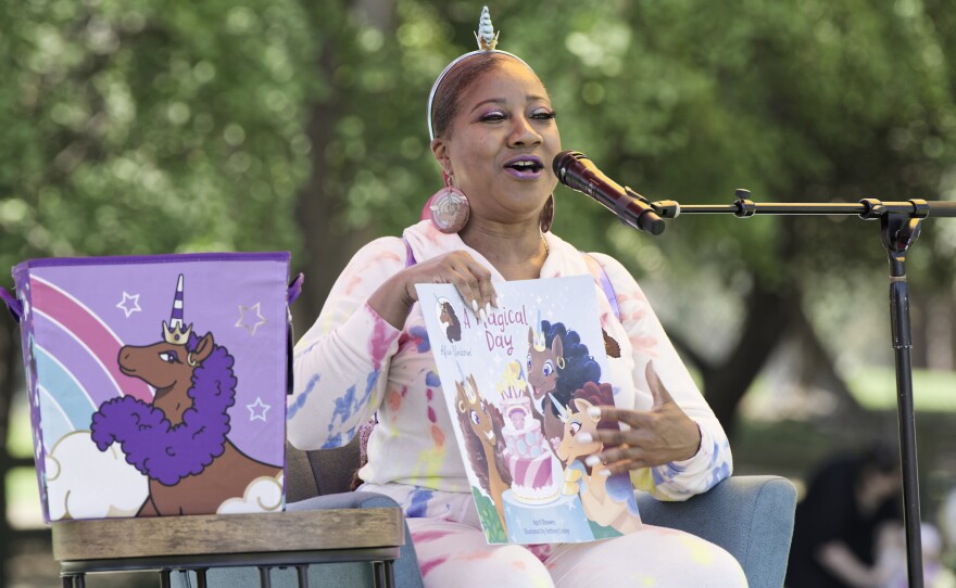 Author April Showers reading a children's book
