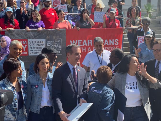 L.A. Mayor Eric Garcetti (center) stands with Denim Day activists and L.A. City Councilmember Nury Martinez (right). 