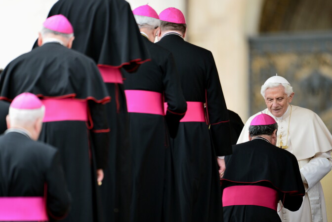 Pope Benedict XVI is welcomed by bishops at the end of his weekly general audience in St. Peter's Square at Vatican on April 18, 2102.     AFP PHOTO / VINCENZO PINTO (Photo credit should read VINCENZO PINTO/AFP/Getty Images)