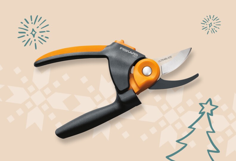 Gardening sheers have a black and orange handle