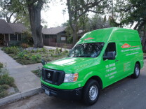  A smoke remediation van is parked on a residential street in Pasadena, a few blocks away from where homes burned down in the Eaton Fire. 