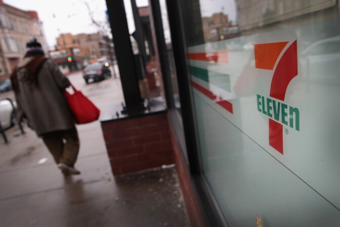 CHICAGO, IL - JANUARY 10:  A pedestrian walks past a 7-Eleven store on January 10, 2018 in Chicago, Illinois. Immigration officials raided nearly 100 7-Eleven stores across the country this morning checking the immigration status of store employees.  (Photo by Scott Olson/Getty Images)
