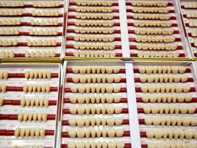 Artificial teeth are kept on hand in the dental area during Care Harbor's annual Los Angeles medical clinic at the Los Angeles Memorial Sports Arena on Thursday, Oct. 31.