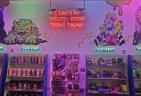 The interior of the Horror Boodega in Burbank is filled with bright colors and shelves lined with horror themed snacks.