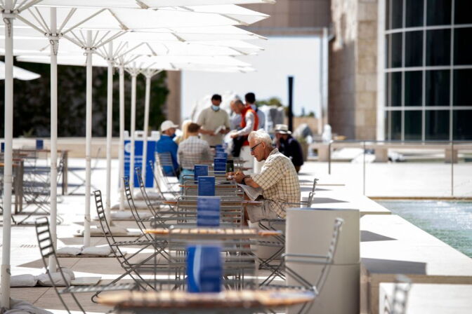 The first visitors enjoy breakfast at the Getty Museum on it's reopening day, May 25, 2021, in Los Angeles. - The museum re-opened at limited capacity following Covid-19 safety guidelines and keeping the small galleries closed. California officials announced the state is on track to remove physical distancing guidelines and fully reopen its economy beginning on June 15. - (Photo by VALERIE MACON / AFP) (Photo by VALERIE MACON/AFP via Getty Images)