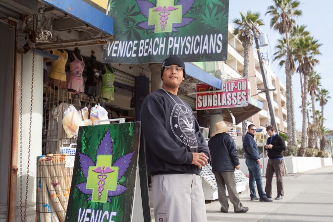 Michael Vides waits for potential patients outside of Venice Beach Physicians.
