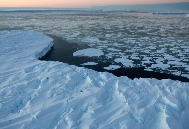 Giant tabular icebergs surrounded by ice floe drift in Vincennes Bay in the Australian Antarctic Territory on January 11, 2008. Australia's CSIRO's atmospheric research unit has found the world is warming faster than predicted by the United Nations' top climate change body, with harmful emissions exceeding worst-case estimates.   
