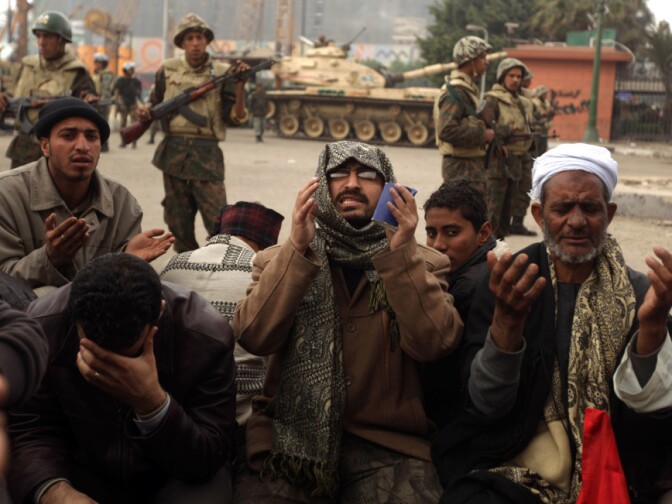 Egyptian anti-government demonstrators and members of the Egyptian Muslim Brotherhood movement pray in Cairo's Tahrir Square on Monday.