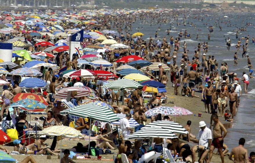 This photo taken 07 August 2003 shows the crowded Malvarrosa beach in Valencia city as Spain as been suffering from a heat wave. At least thirteen people died from an intensive heat wave.         (Photo credit should read JOSE JORDAN/AFP/Getty Images)
