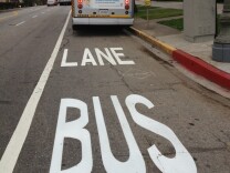 Dedicated bus-only lanes have been painted on Wilshire Boulevard, like this sign at South Park View Street.