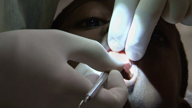 7-year-old Darrien Ryan gets his teeth cleaned. Darrien said after this he was considering being a dentist when he grew up because it seemed so cool.
