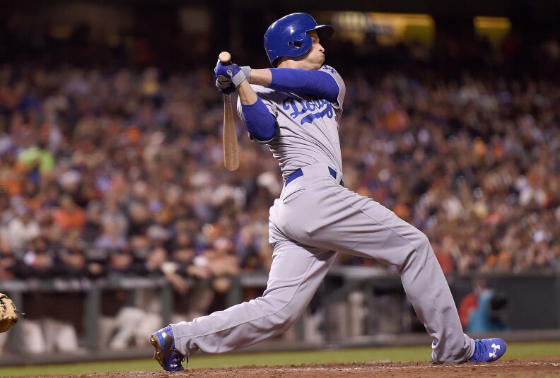SAN FRANCISCO, CA - SEPTEMBER 29:  Corey Seager #5 of the Los Angeles Dodgers hits an rbi single scoring Adrian Gonzalez #23 against the San Francisco Giants in the top of the eighth inning at AT&T Park on September 29, 2015 in San Francisco, California.  (Photo by Thearon W. Henderson/Getty Images)