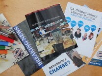New Los Angeles Unified school board candidates are spending hundreds of thousands of dollars on ads attacking incumbents and other mailers.