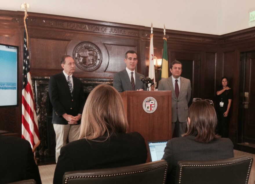 Mayor Eric Garcetti presents his annual budget proposal with Deputy Mayor Rick Cole, left, and City Administrative Officer Miguel Santana