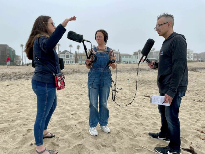 A Martínez interviews Kathleen Treseder at Sunset Beach in Orange County, California.