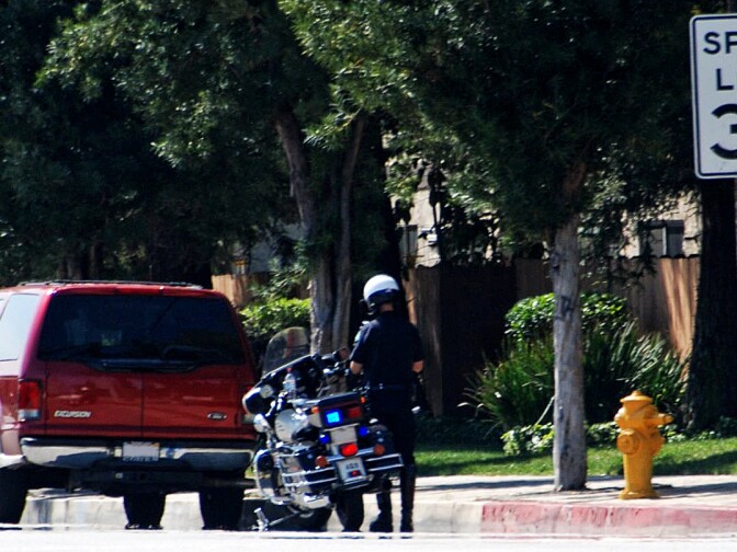 File photo of a cop pulling over a vehicle. 
