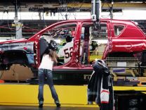Workers build a Jeep Compass at the Chrysler assembly plant in Belvidere, Ill. Strong demand for the Ram pickup truck helped drive Chrysler's sales up 11 percent in April 2013 as the company posted its best April in six years.The increase is another sign that Americans continue to buy cars and trucks despite high unemployment and mixed economic signals.