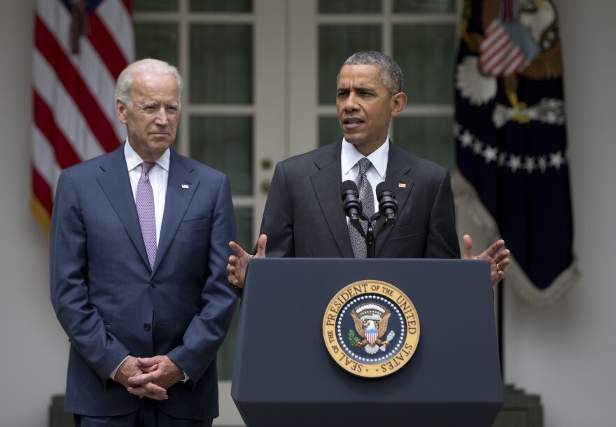 President Barack Obama, accompanied by Vice President Joe Biden, speaks in the Rose Garden of the White House, Thursday, June 25, 2015, in Washington, after the U.S. Supreme Court upheld the subsidies for customers in states that do not operate their own exchanges under President Barack Obama's Affordable Care Act. (AP Photo/Carolyn Kaster)