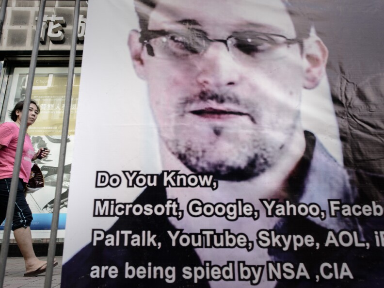 U.S. Secretary of State John Kerry said Monday it would be "deeply troubling" if Russia or Hong Kong had adequate notice about Edward Snowden's plans to flee to a country that will grant him asylum and still allowed him leave. (Photo: A woman in Hong Kong walks past a banner displayed in support of Snowden last week).