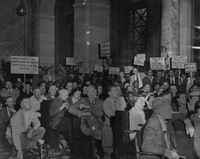 1951: "400 sign-waving residents of Chavez Ravine, protesting a proposed housing project that would take the sites of their homes, appeared April 26, 1951, at the City Planning Commission's final hearing on the matter. Sporadic booing and hissing swept over the crowd when a speaker suggested immediate approval of the project." Courtesy of the Los Angeles Public Library