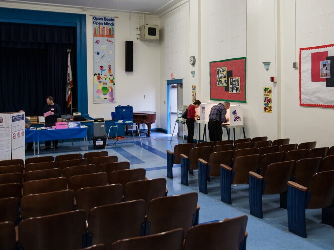Voters cast their ballots in the auditorium at Palms Elementary School in Culver City on March 5th, 2013.