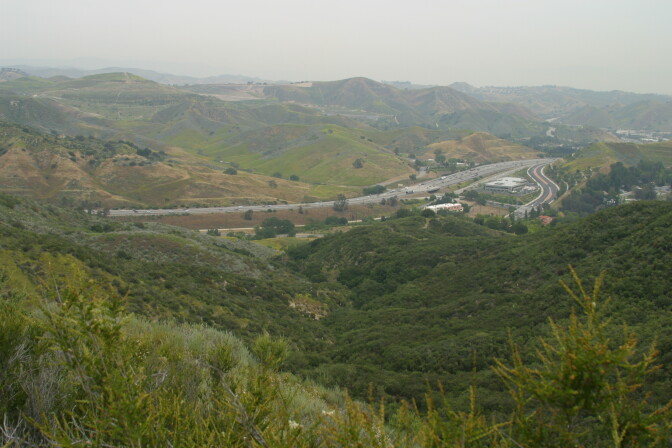 Wildlife experts are pushing for a crossing for mountain lions near the Liberty Canyon exit on the 101 Freeway, seen here. Roads, particularly freeways, are one of the major challenges to the long-term survival of mountain lions in the Santa Monica Mountains, and a crossing here would connect terrain to the north.