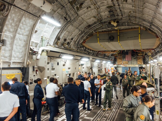 Air Force Junior Reserve Officer Training Corps cadets and Airmen participating in an aeromedical evacuation proficiency training mission aboard a Boeing C-17.