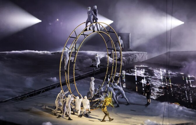 A group of people on a wheel during the closing ceremony