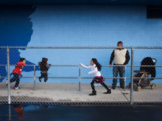 Amaury Melendez watches over his children at the Banda El Salvador performance at Duarte High School. He also saw the band perform when they came to the states in 2008.
