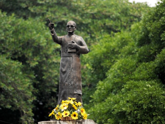 Flowers are placed on the statue of monsignor Oscar Arnulfo Romero in downtown San Salvador, on April 22, 2013. A Vatican official responsible for the sainthood cause of Archbishop Oscar Romero of El Salvador announced that the cause has been 'unblocked' by Pope Francis, suggesting that beatification of the assassinated prelate could come swiftly. Monsignor Romero was murdered on March 24, 1980 during a mass.