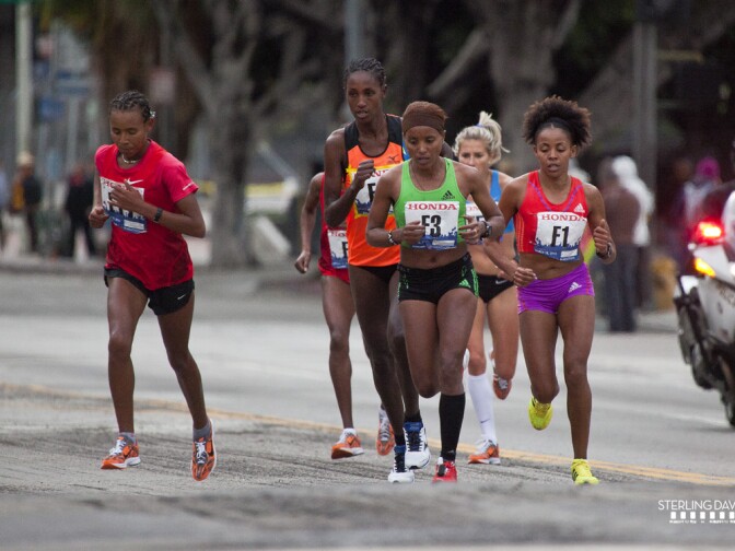 Winner Fatuma Sado (L) at Mile 5 of the 2012 LA Marathon.