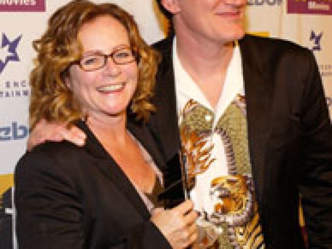 Editor Sally Menke with her Editing award poses with director Quentin Tarantino backstage at The Hollywood Awards Gala at the Beverly Hilton Hotel October 18, 2004 in Beverly Hills, California.