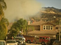 The Sand Fire smolders near homes off Golden Valley Rd Sunday afternoon. 


The Sand Fire burns in the Angeles National Forest Sunday July 24th, 2016 under a Red Flag Warning high high winds. The fire had burned 22,000 acres by Sunday morning and was 10% contained as firefighters battled low humidity, shifting wind, and high temperatures. An unknown number of structures were lost. 