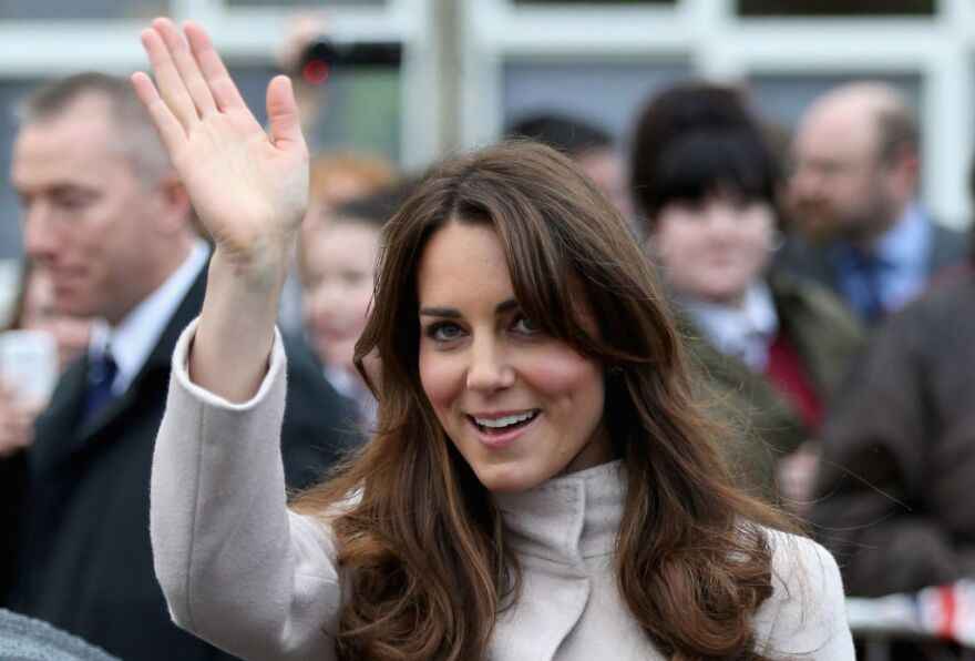 Catherine, Duchess of Cambridge waves as she leaves  Manor School as she pays an official visit to Cambridge with Prince William, Duke of Cambridge on November 28, 2012 in Cambridge, Cambridgeshire.   