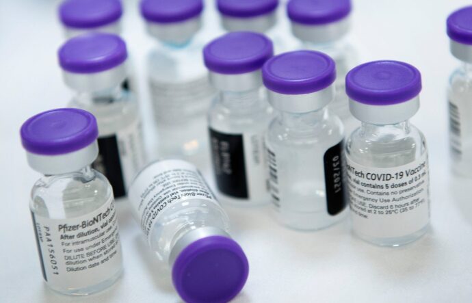 Vials of undiluted Pfizer COVID-19 vaccine are  prepared to administer to staff and residents at the Goodwin House Bailey's Crossroads, a senior living community in Falls Church, Virginia.