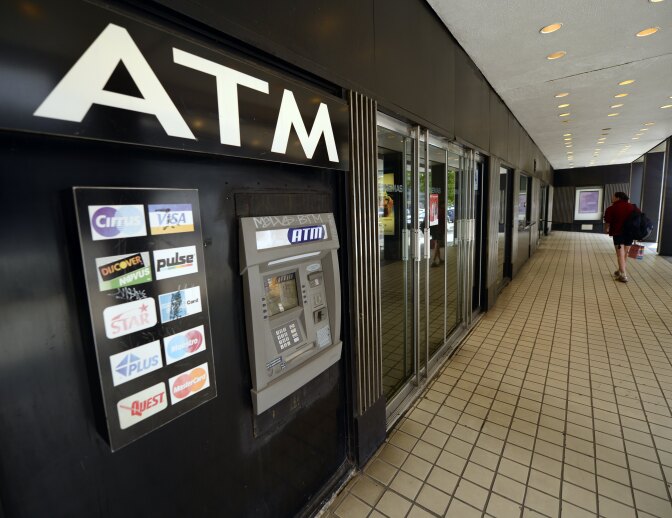 Caption:An ATM machine on Third Avenue is viewed in New York on May 10, 2013, just one of the many that were used as cyber thieves around the world stole $45 million by hacking into debit card companies, scrapping withdrawal limits and helping themselves from cash machines, US authorities said May 9, 2013. The massive heist unfolded 'in a matter of hours,' said the US prosecutor's office for Brooklyn, New York. Prosecutors unveiled charges against eight people accused of forming the New York cell of the plot, which stretched across 26 countries. In their case, they allegedly lifted $2.8 million in cash and now face charges of conspiracy to commit access device fraud and money laundering. Seven of the eight have been arrested, the US attorney's office said. The eighth, Alberto Yusi Lajud-Pena, who was the leader and was nicknamed 'Prime' and 'Albertico,' is reported to have been murdered two weeks ago, the office said. AFP PHOTO / TIMOTHY A. CLARY (Photo credit should read TIMOTHY A. CLARY/AFP/Getty Images)
