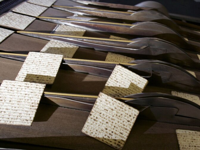 Matzot emerge from the oven on a conveyor belt at the Manischewitz plant, formerly in Jersey City, N.J., in this file photo.