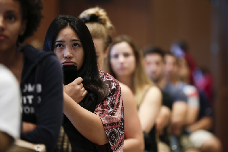 New students at San Diego State University watch a video on sexual consent during an orientation meeting Friday, Aug. 1, 2014, in San Diego. Defining consensual sex is a growing trend by universities under pressure to do more to protect victims. Throughout the country, schools have been adopting policies on their own that set the parameters for distinguishing when consent was given for a sexual activity and when it was not.  (AP Photo/Gregory Bull)