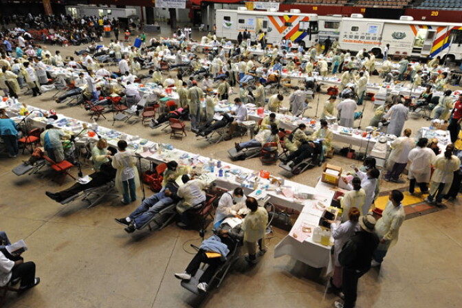 Patients receive free dental care at a clinic sponsored by Remote Area Medical (RAM), a Tennessee-based nonprofit, in Los Angeles on April 28, 2010. RAM is offering free medical, vision and dental services to those without health insurance for about 1,200 people per day in the week-long Los Angeles event.