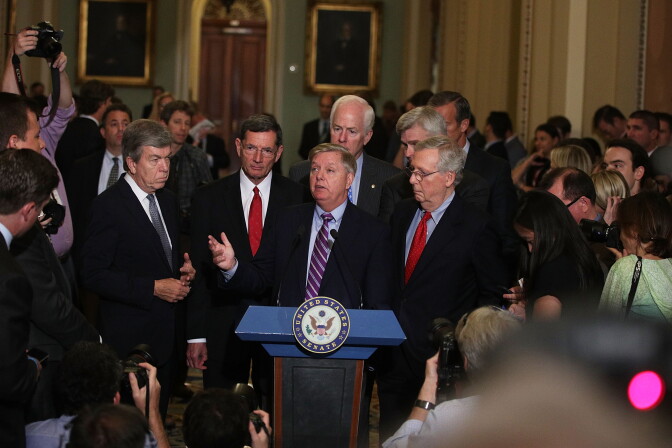 WASHINGTON, DC - SEPTEMBER 19:  U.S. Sen. Lindsey Graham (R-SC) (3rd L) speaks as (L-R) Sen. Roy Blunt (R-MO), Sen. John Barrasso (R-WY), Senate Majority Whip Sen. John Cornyn (R-TX), Sen. Bill Cassidy (R-LA), and Senate Majority Leader Sen. Mitch McConnell (R-KY) listen during a news briefing after the weekly Senate Republican policy luncheon at the Capitol September 19, 2017 in Washington, DC. Senate Republican held a weekly policy luncheon to discuss GOP agenda.  (Photo by Alex Wong/Getty Images)